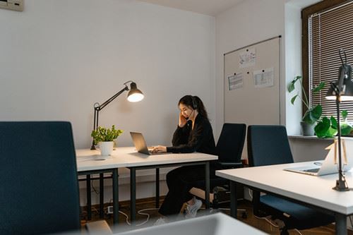 Canva - Woman in Black Long Sleeve Shirt Sitting on Blue Chair_ Canva - Woman in Black Long Sleeve Shirt Sitting on Blue Chair_